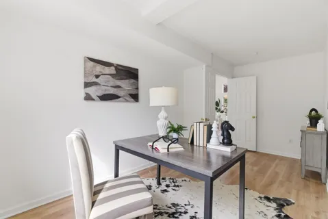 a view of a dining room with furniture window and outside view