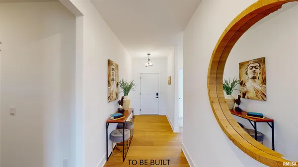 a hallway with potted plants and wooden floor