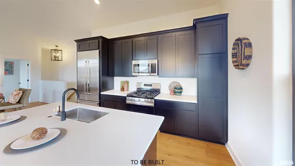 a view of storage and utility room with washer and dryer