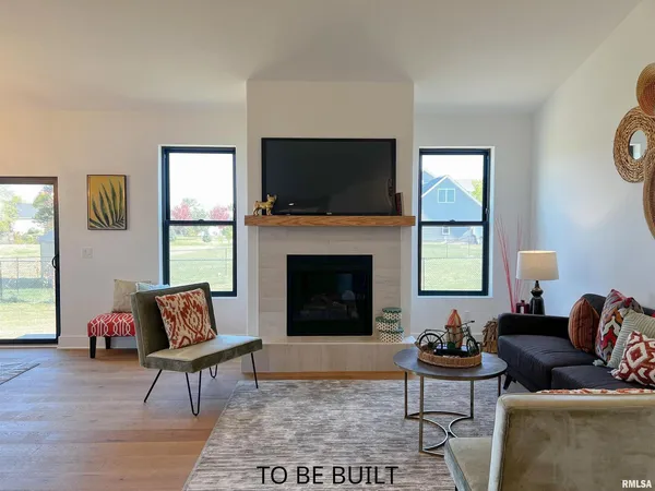 a living room with fireplace furniture and a flat screen tv