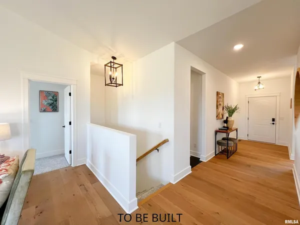 a view of a hallway with a dining area