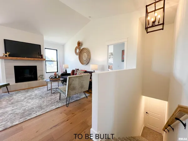 a kitchen with kitchen island a counter top space cabinets and stainless steel appliances