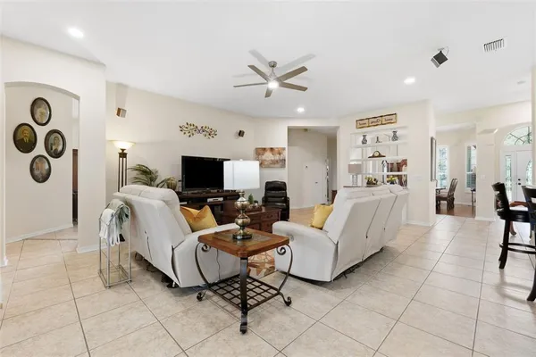 a view of a dining room with furniture and chandelier