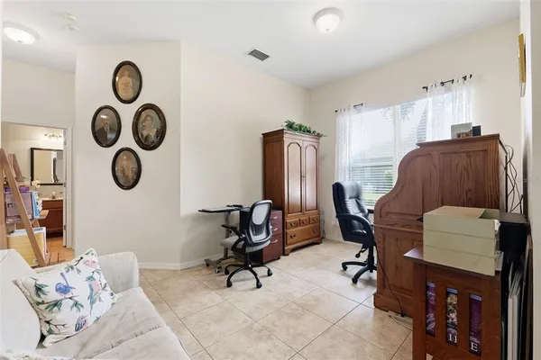 a view of a livingroom with workspace and a couch