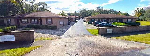 a front view of a house with yard