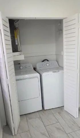 a utility room with dryer and washer