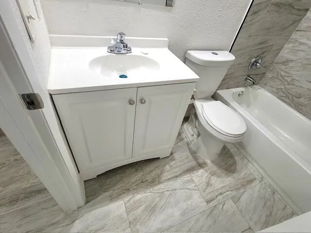 a bathroom with a sink and a toilet