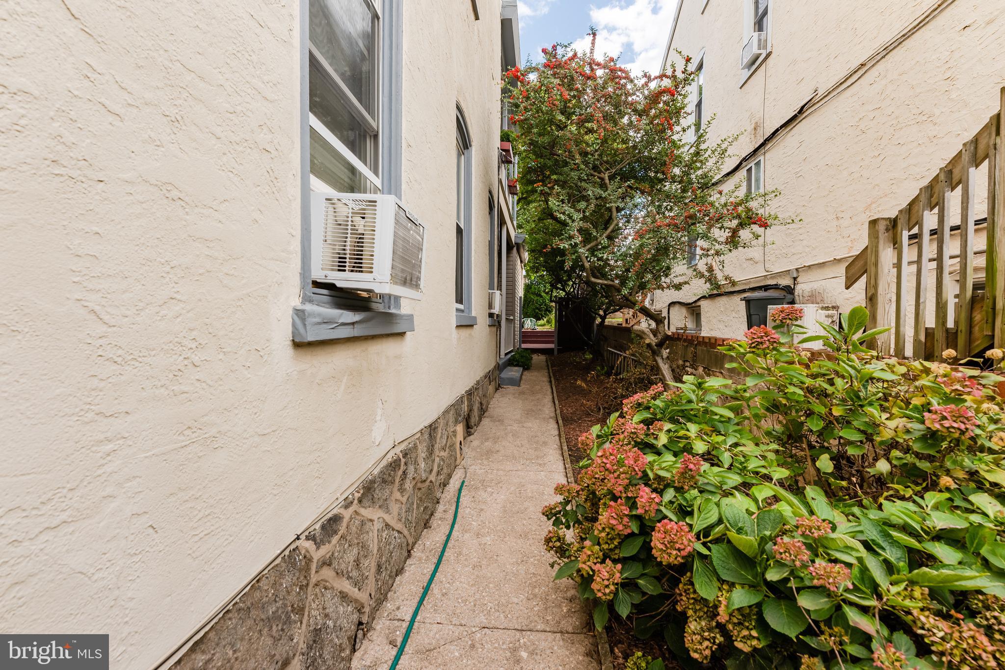 239 Roxborough Avenue Philadelphia, PA 19128 - Photo 5 of 45 side walkway to 1st floor side door and porch