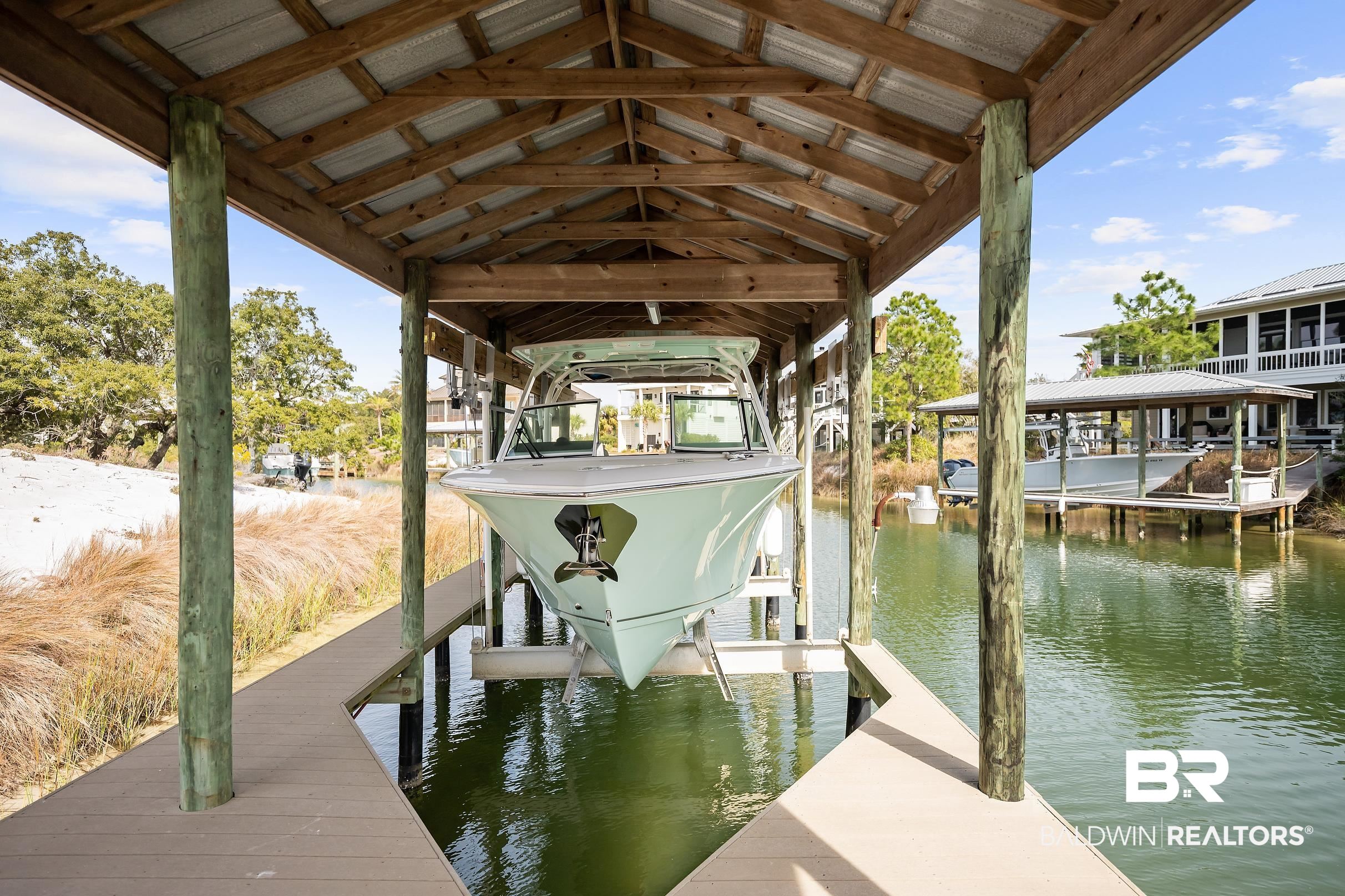 33186 Marlin Key Drive Orange Beach, AL 36561 - Photo 21 of 87 Dock area with boat lift and a water view