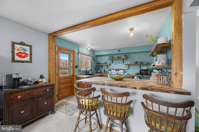 a dining room with a table and chairs