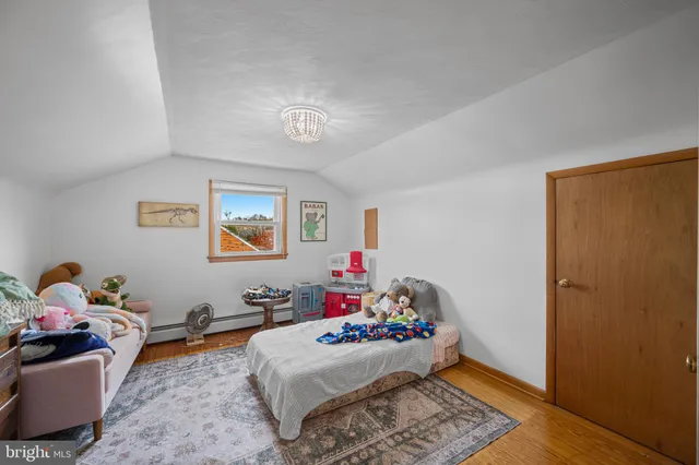 a room with furniture and a wooden floor