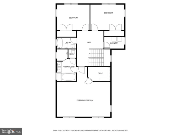 a picture of a bench in front of a gate