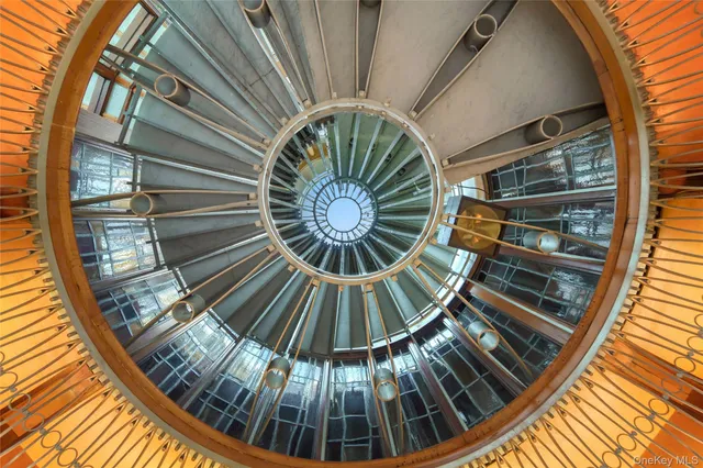 a living room with furniture a fireplace and windows