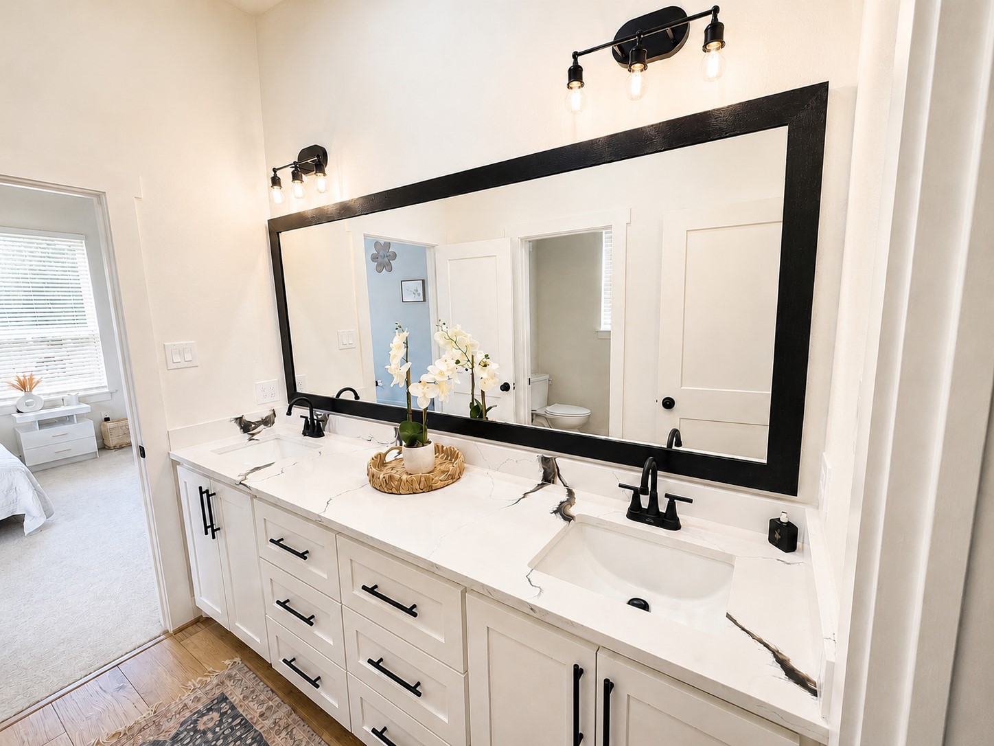 440 Farm To Market 223 Shepherd, TX 77371 - Photo 28 of 40 a bathroom with a double vanity sink and a mirror