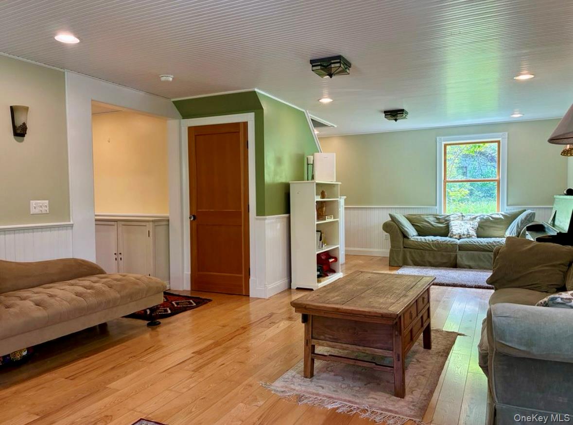 96 Bruceville Road High Falls, NY 12440 - Photo 5 of 21 a bedroom with a bed and wooden floor