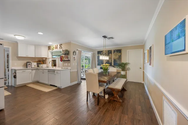a bedroom with a large bed a flat tv screen and a walk in closet