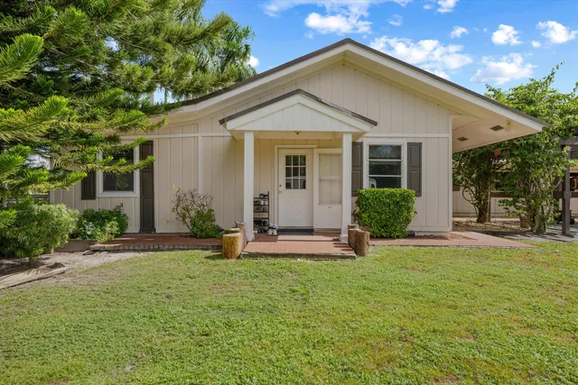 a kitchen with a stove a sink and a refrigerator