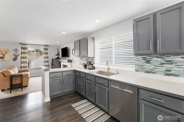 a kitchen with sink cabinets and window