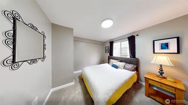 a bedroom with a bed and window