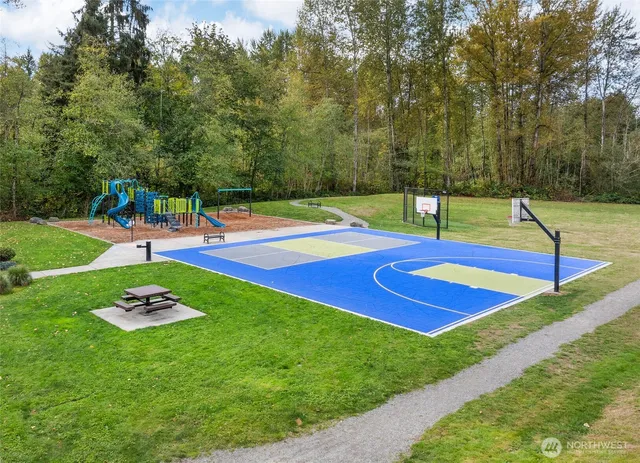 a view of a backyard with swimming pool