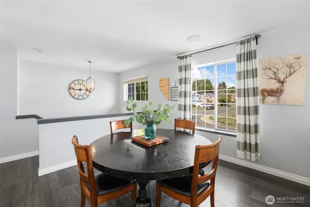 a view of a dining room with furniture window and wooden floor