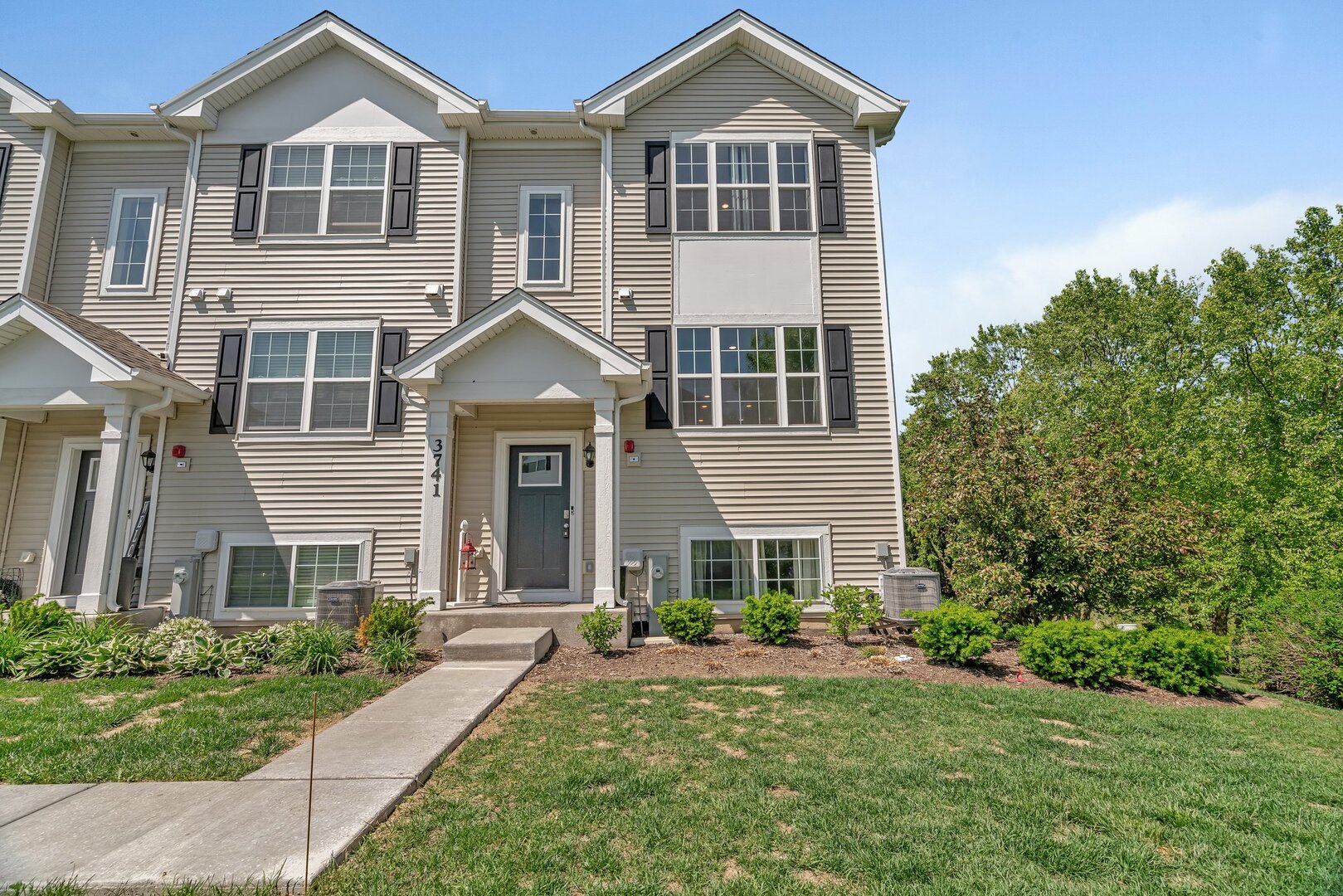 3741 Bailey Road Yorkville, IL 60560 - Photo 2 of 32 a front view of a house with a yard