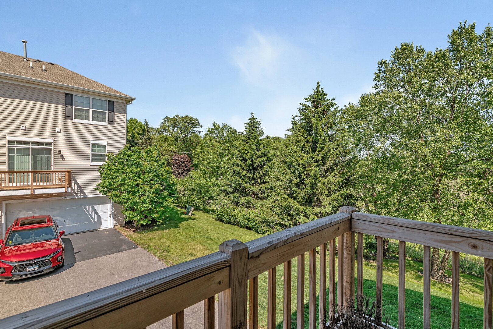 3741 Bailey Road Yorkville, IL 60560 - Photo 30 of 32 a balcony with trees in front of it