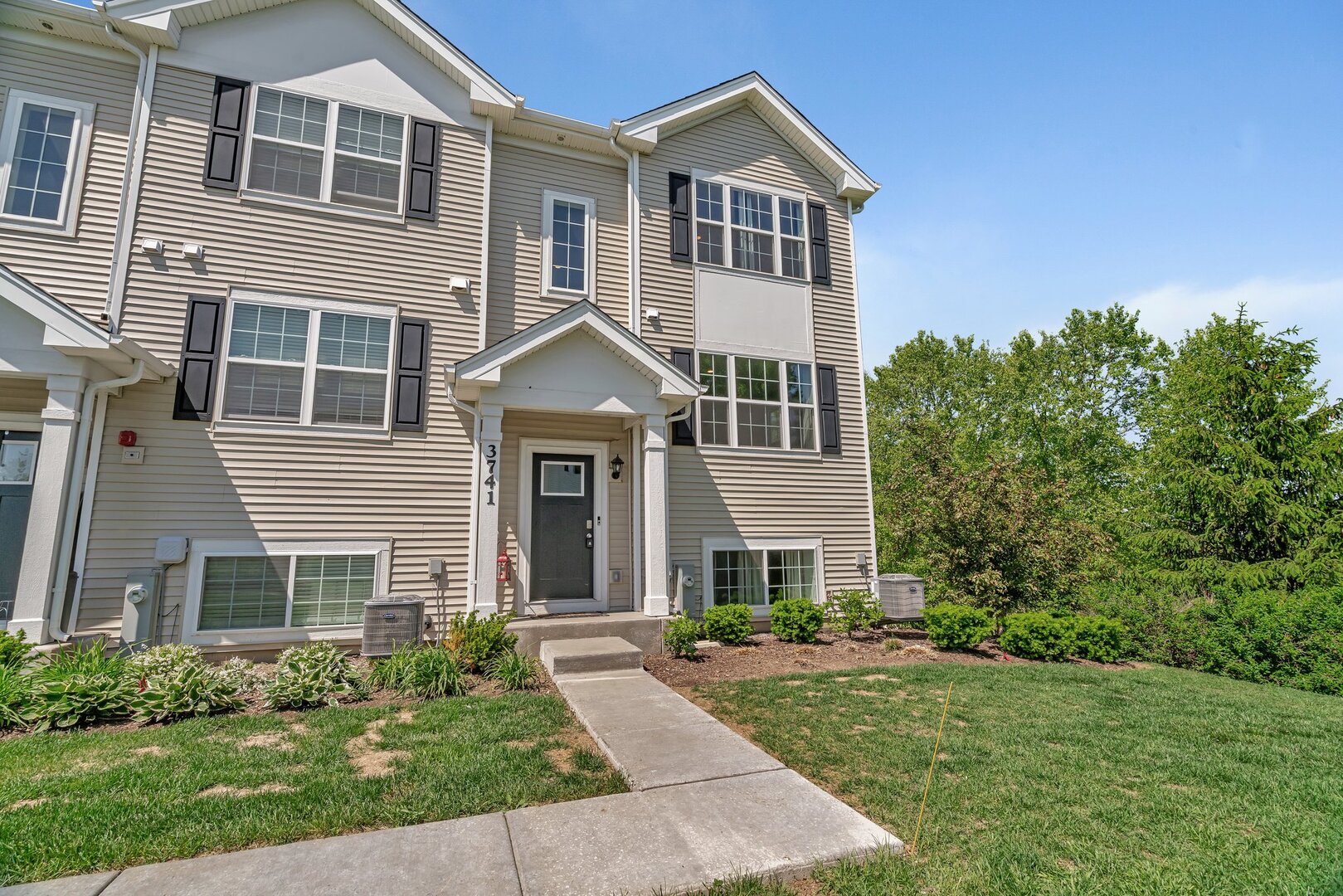 3741 Bailey Road Yorkville, IL 60560 - Photo 3 of 32 a front view of a house with a yard
