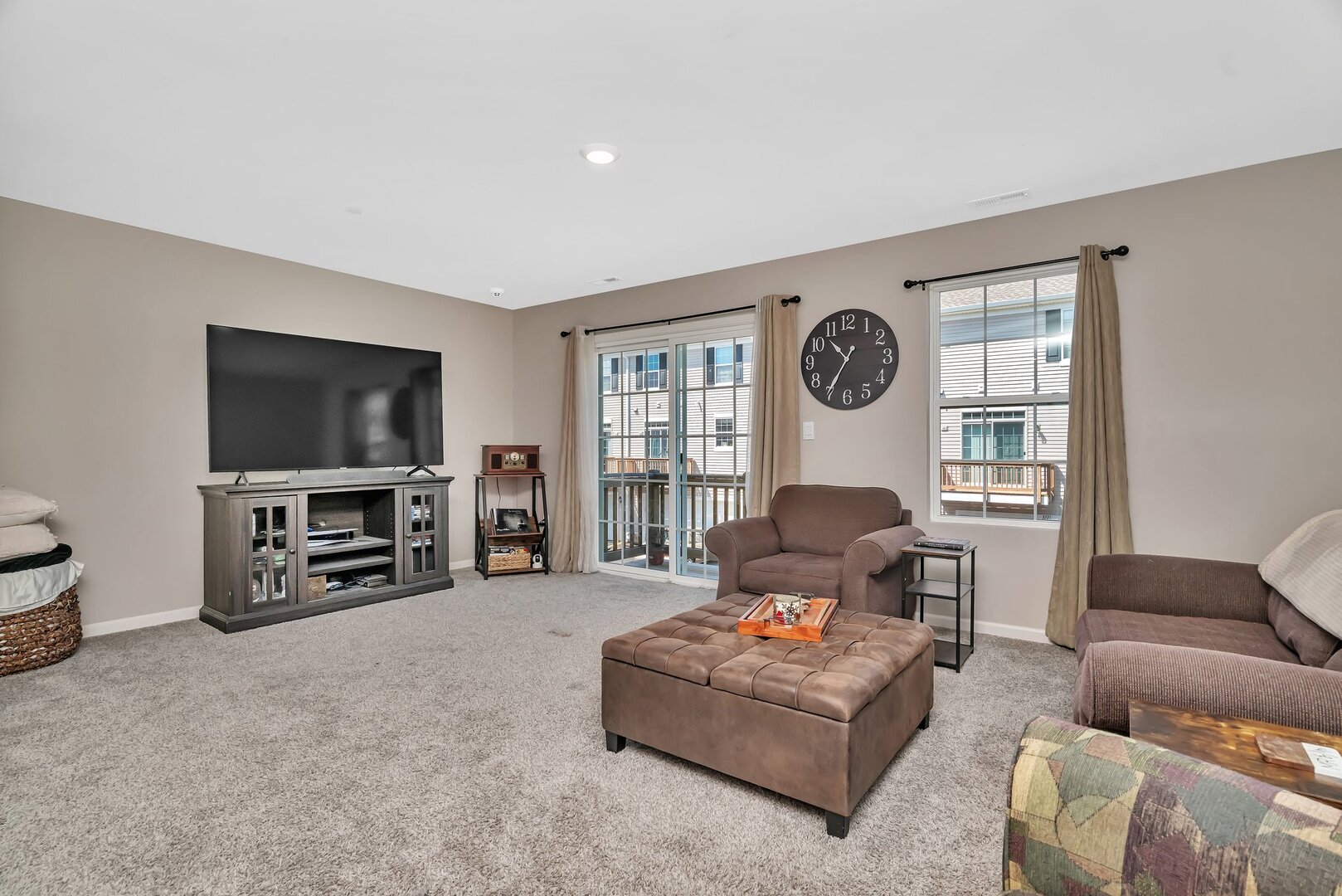 3741 Bailey Road Yorkville, IL 60560 - Photo 5 of 32 a living room with furniture a flat screen tv and a window