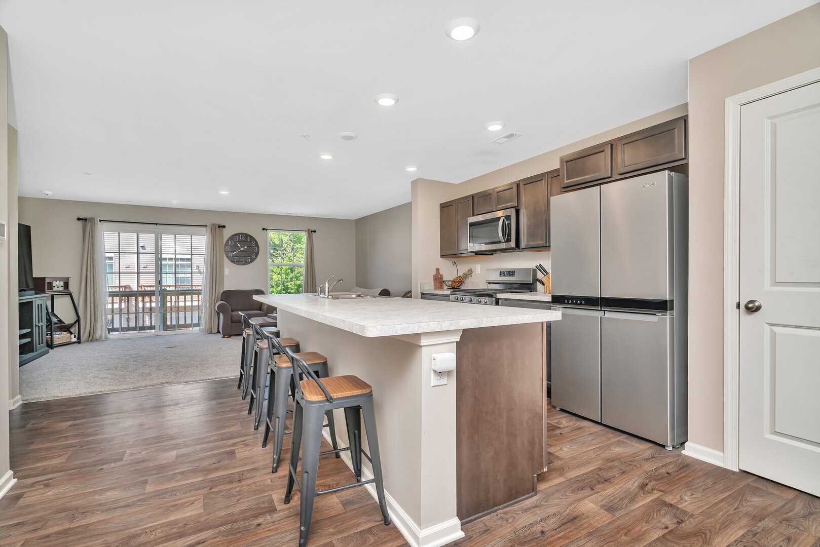 3741 Bailey Road Yorkville, IL 60560 - Photo 10 of 32 a kitchen with a refrigerator a table and chairs