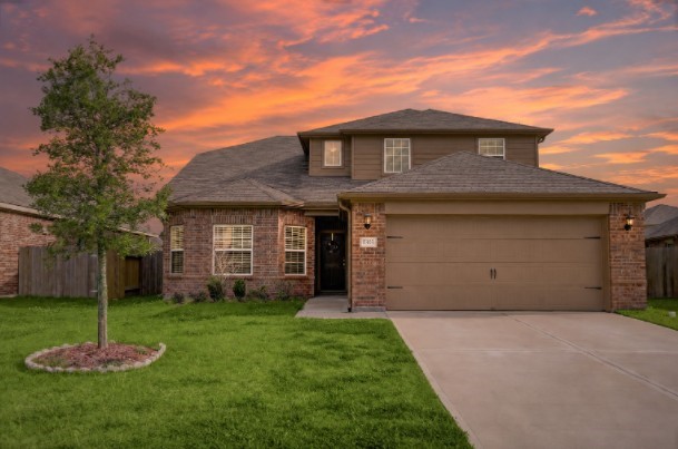 1303 Emerald Stone Drive Rosharon, TX 77583 - Photo 1 of 25 Charming front elevation with inviting curb appeal, mature landscaping, and a warm welcoming entrance.