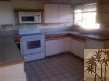 71567 Mirage Road Rancho Mirage, CA 92270 - Photo 3 of 6 a kitchen with a stove and a microwave