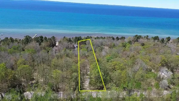 $900,000 | 404 South Golden Beach Drive, Kewadin, MI 49648