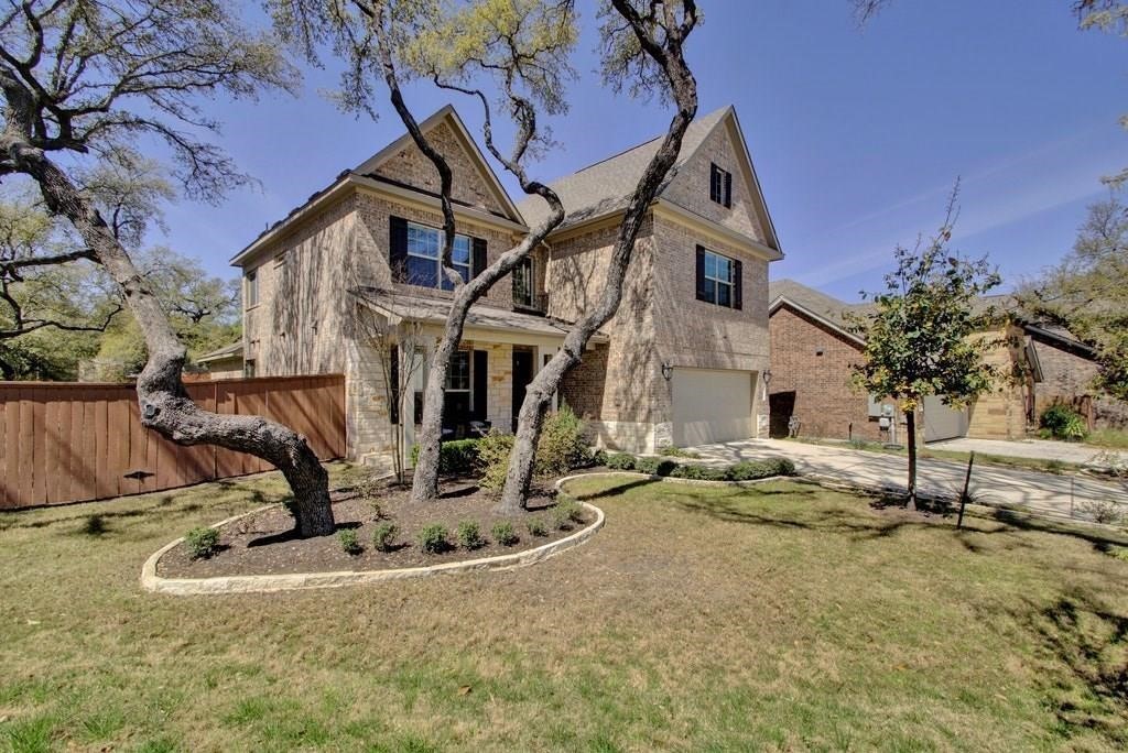 10825 Ballard Path Austin, TX 78717 - Photo 3 of 39 a view of a house with backyard and trees