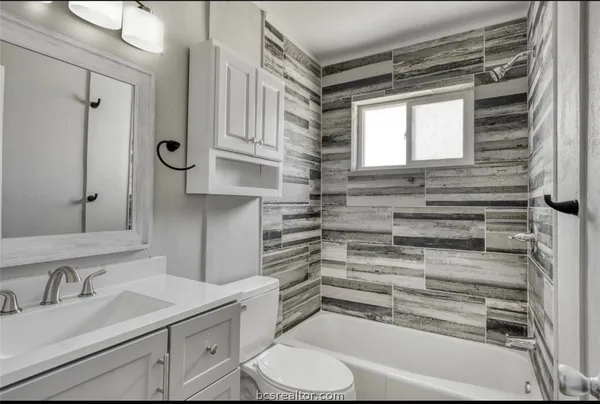 a kitchen with a stove and a microwave