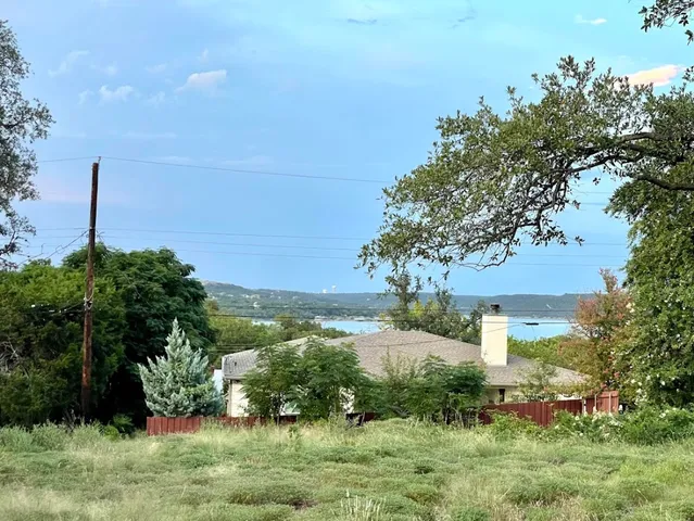 a view of house with a chairs and table in a patio