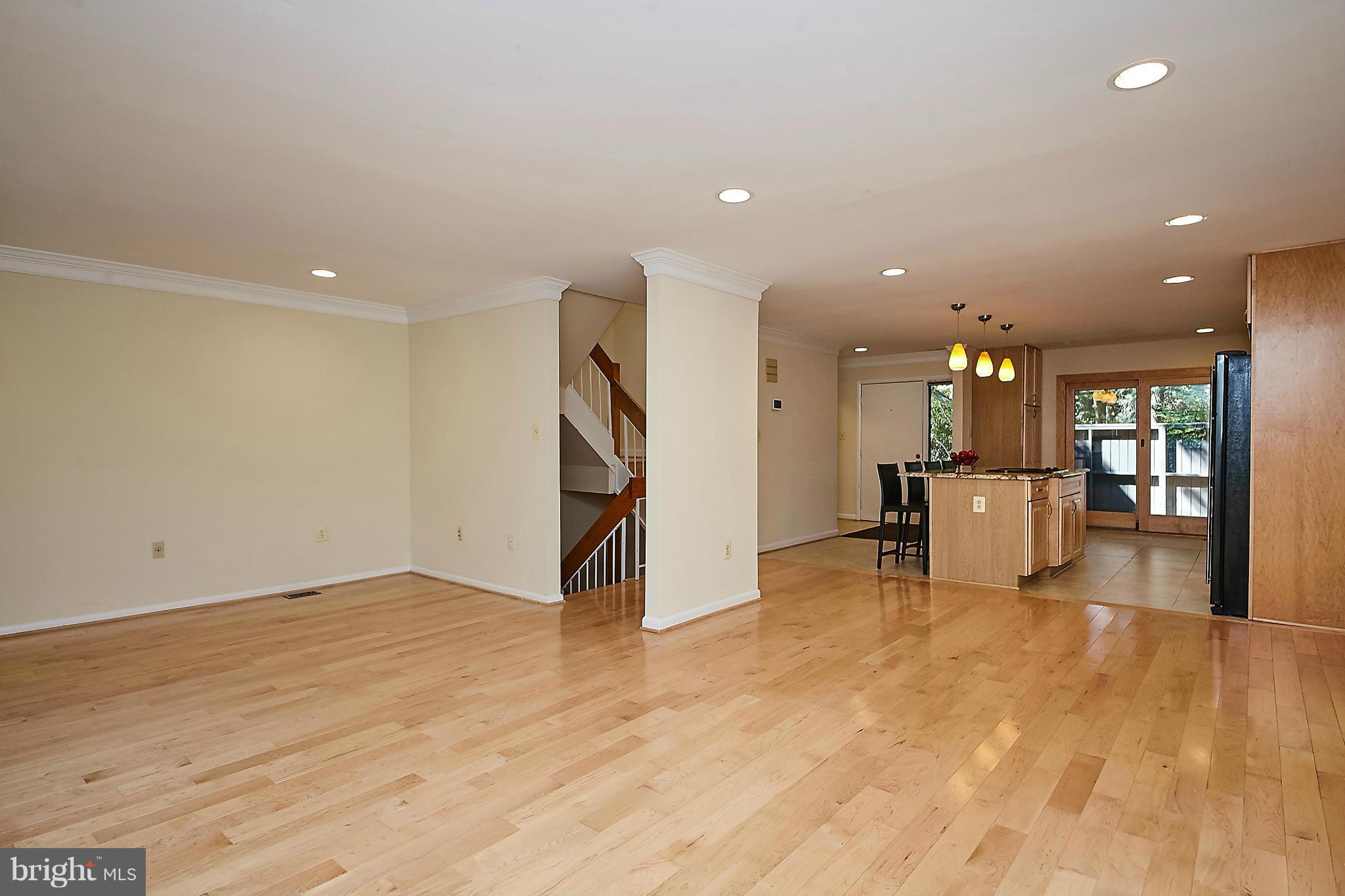 2017 Wethersfield Court Reston, VA 20191 - Photo 12 of 30 Living room spans width of townhome.