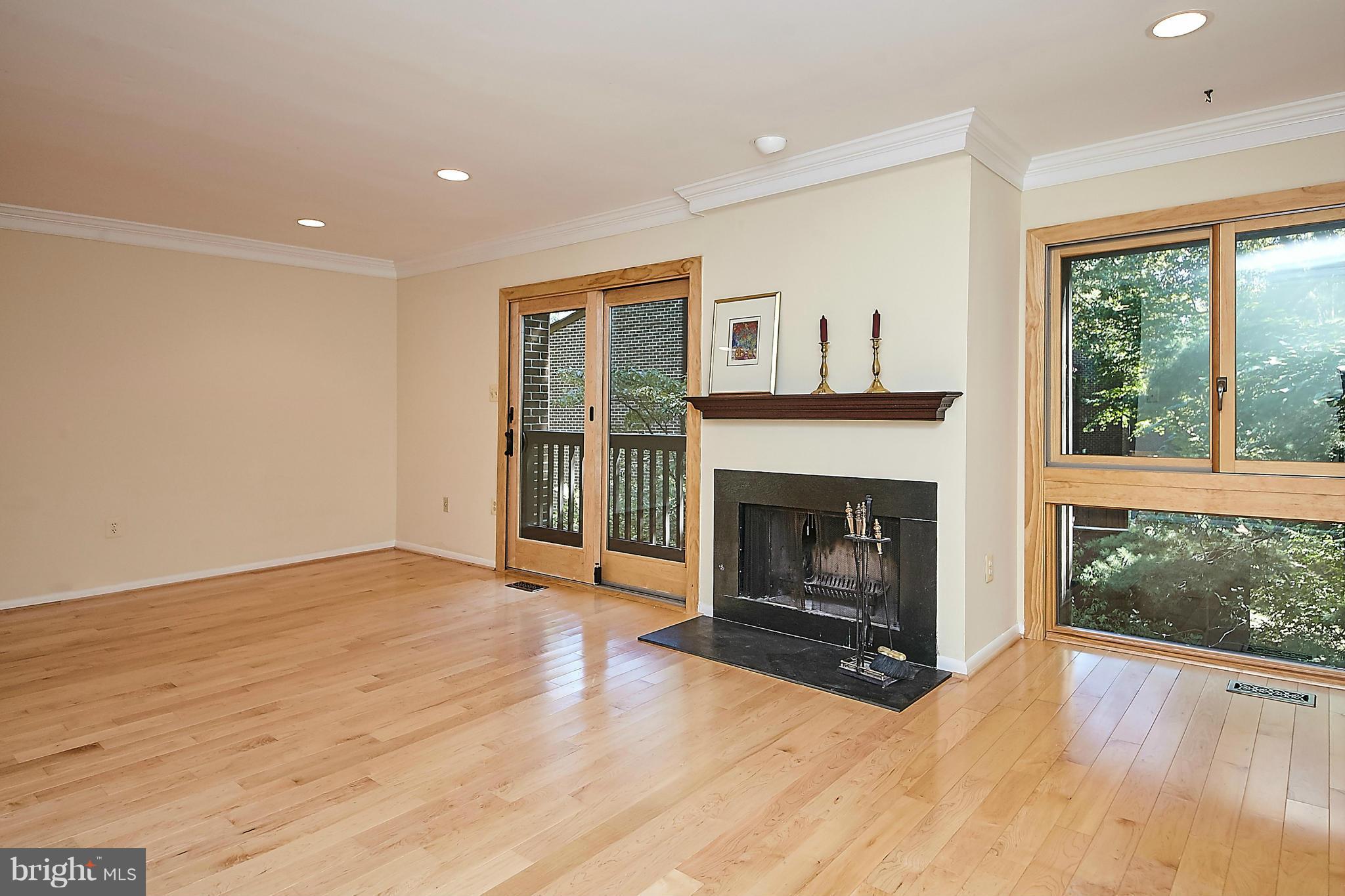 2017 Wethersfield Court Reston, VA 20191 - Photo 14 of 30 Fireplace and slider to back balcony.