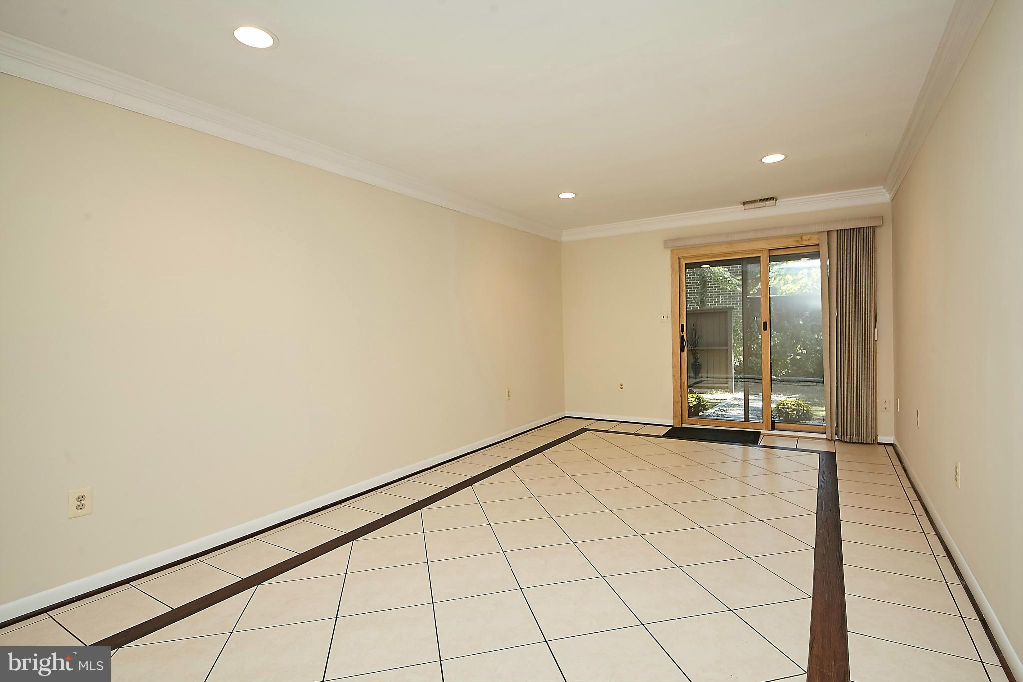 2017 Wethersfield Court Reston, VA 20191 - Photo 24 of 30 Spacious tiled family room with door to back yard.