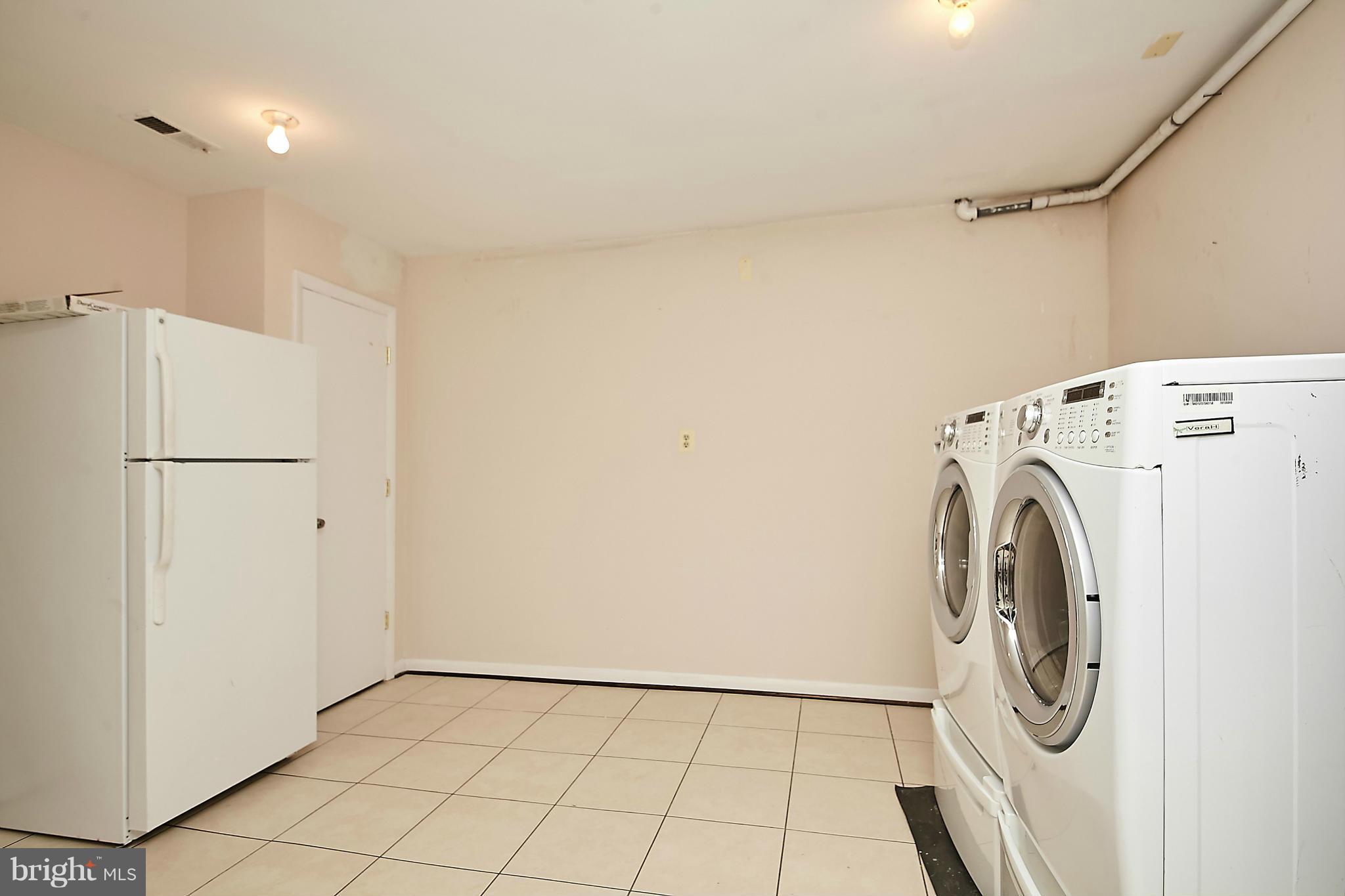 2017 Wethersfield Court Reston, VA 20191 - Photo 27 of 30 Laundry room, extra frig, laundry sink. Storage!