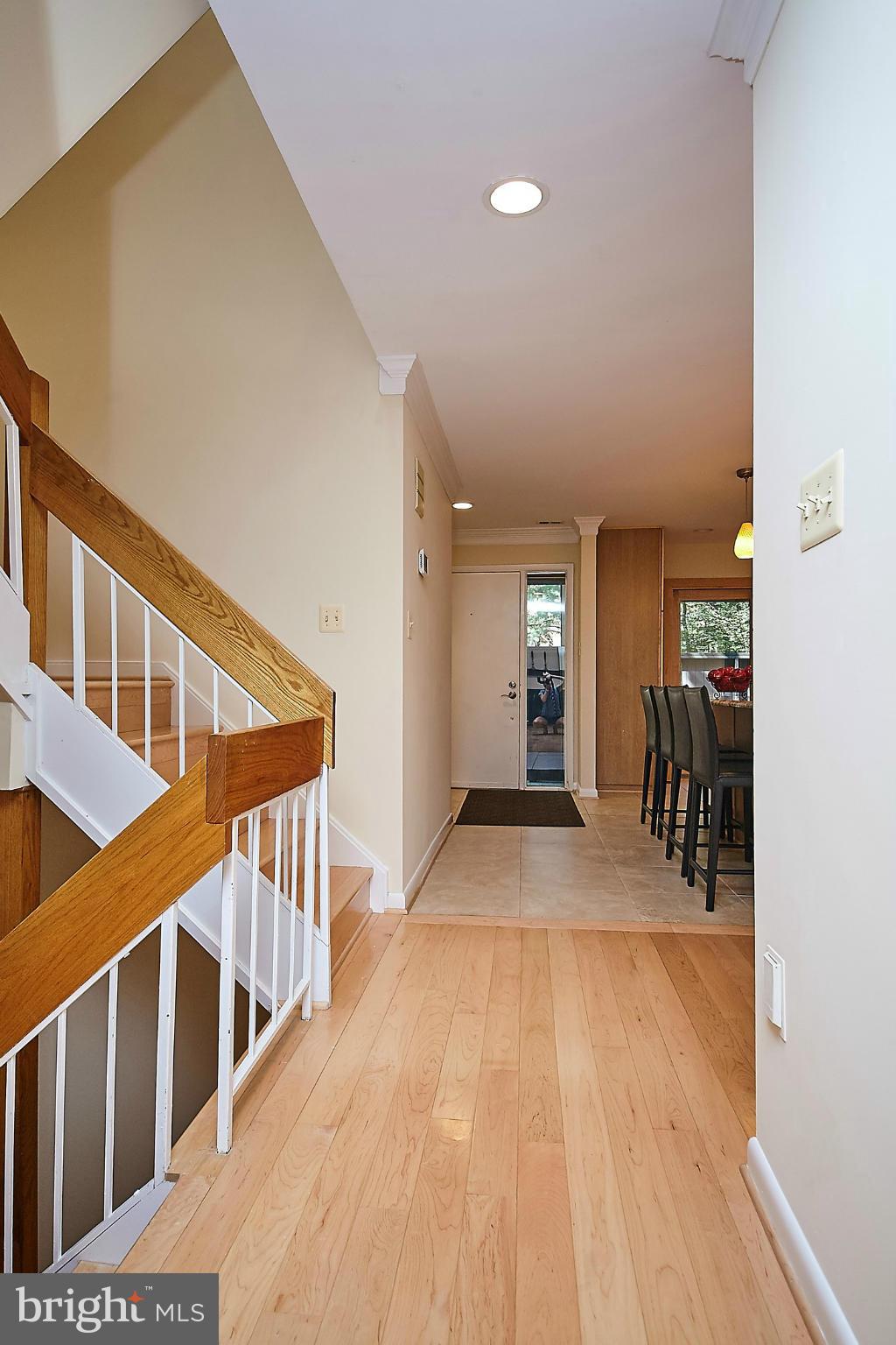 2017 Wethersfield Court Reston, VA 20191 - Photo 4 of 30 View of front door. Open stairs lit by skylight.