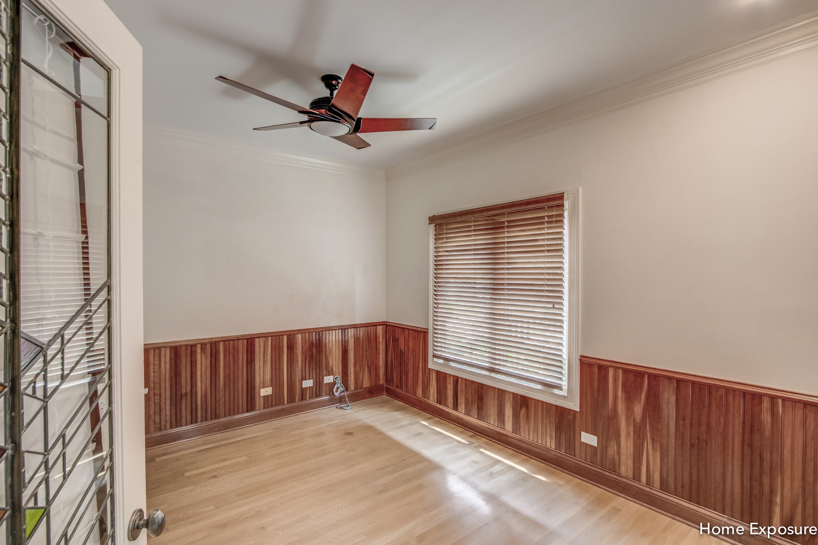 2552 Sutton Lane Aurora, IL 60502 - Photo 18 of 57 a view of an empty room with a window and wooden floor