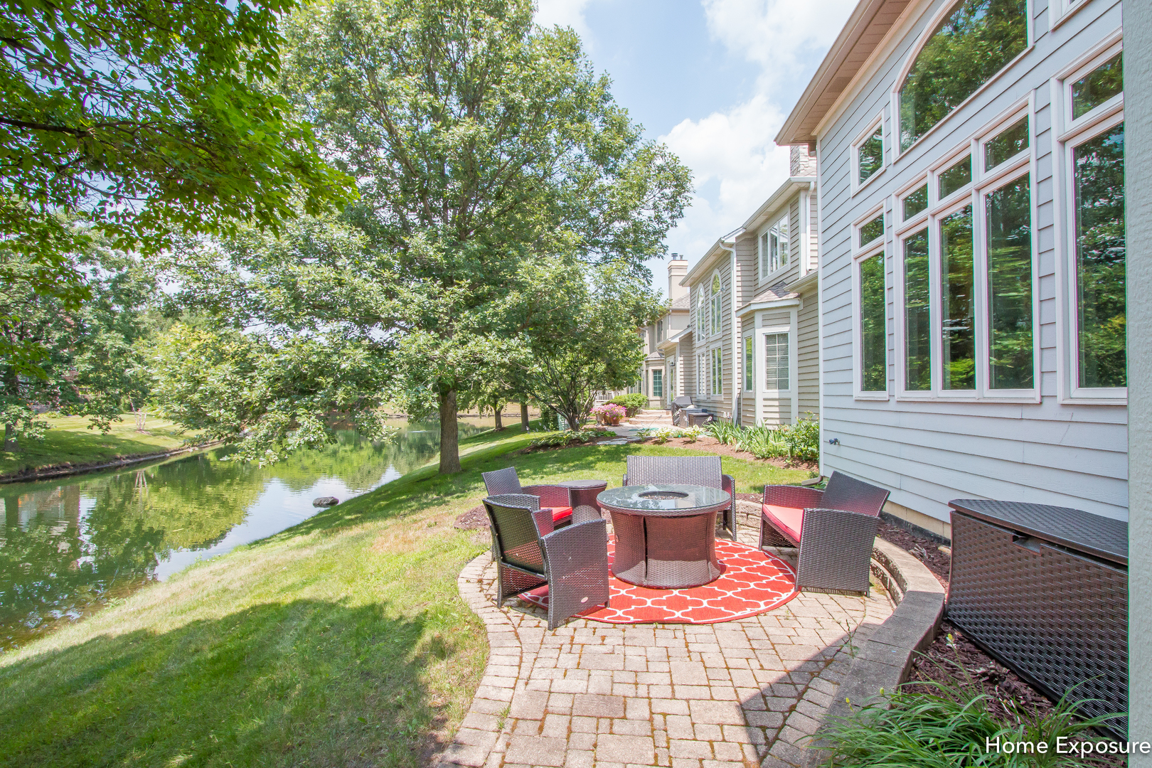 2552 Sutton Lane Aurora, IL 60502 - Photo 45 of 57 a view of a patio with table and chairs potted plants and floor to ceiling window