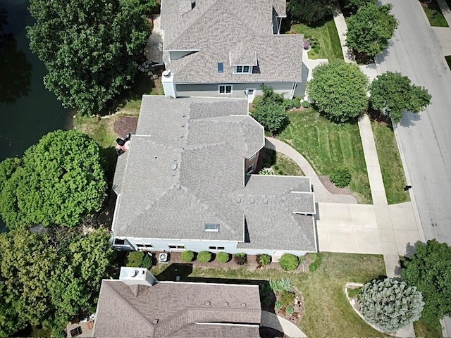 2552 Sutton Lane Aurora, IL 60502 - Photo 46 of 57 an aerial view of a house with a yard and large tree