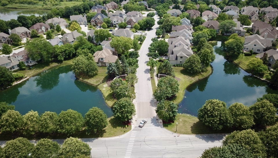 2552 Sutton Lane Aurora, IL 60502 - Photo 52 of 57 an aerial view of a house with outdoor space and lake view