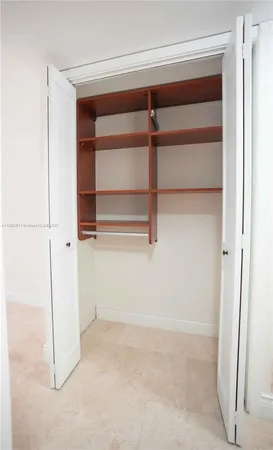 a view of an empty walk in closet
