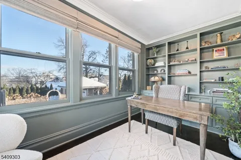 a bedroom with a bed and a television