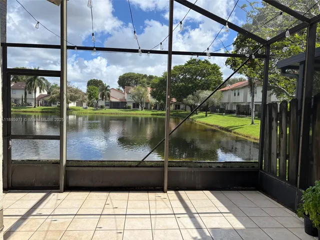 a view of a town with palm trees
