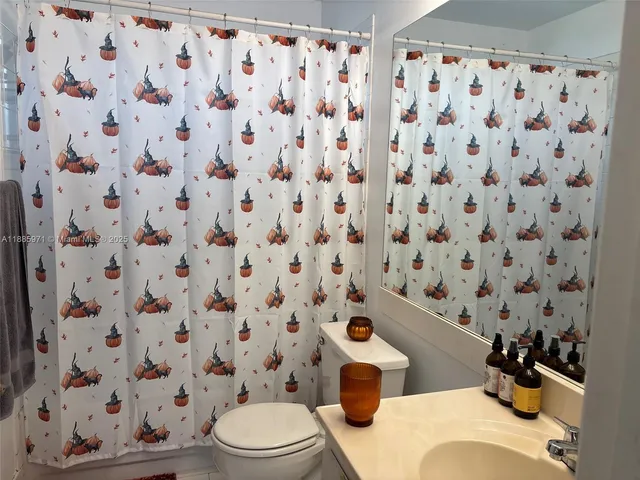 a bathroom with a toilet and a sink