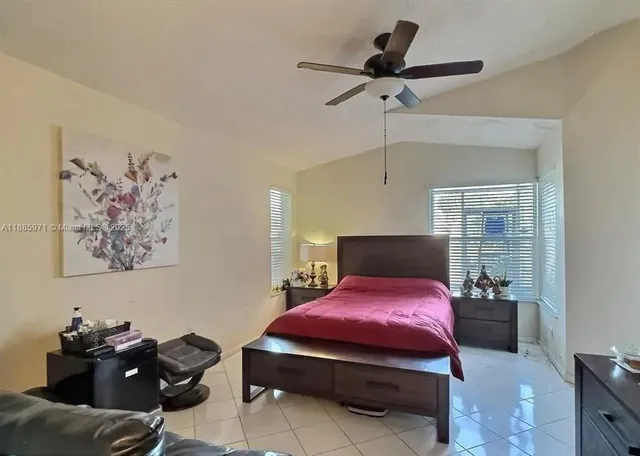 a bedroom with furniture on the floor and window